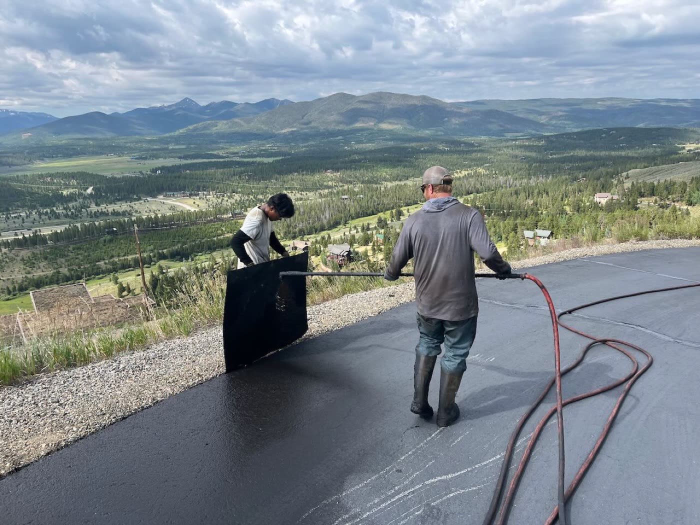 Hot-pour crack sealing repair on residential driveway — Grand County