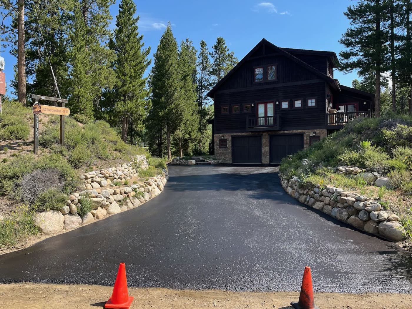 Driveway edge detail after seal coat application — Grand County