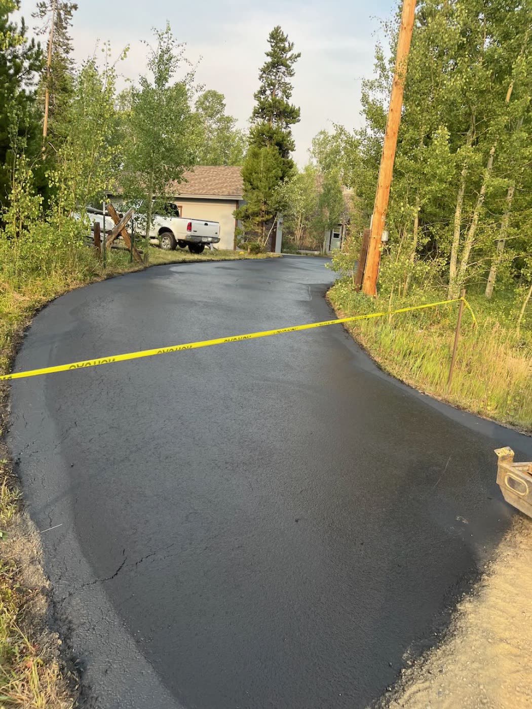 Asphalt seal coating project — Grand County mountain community