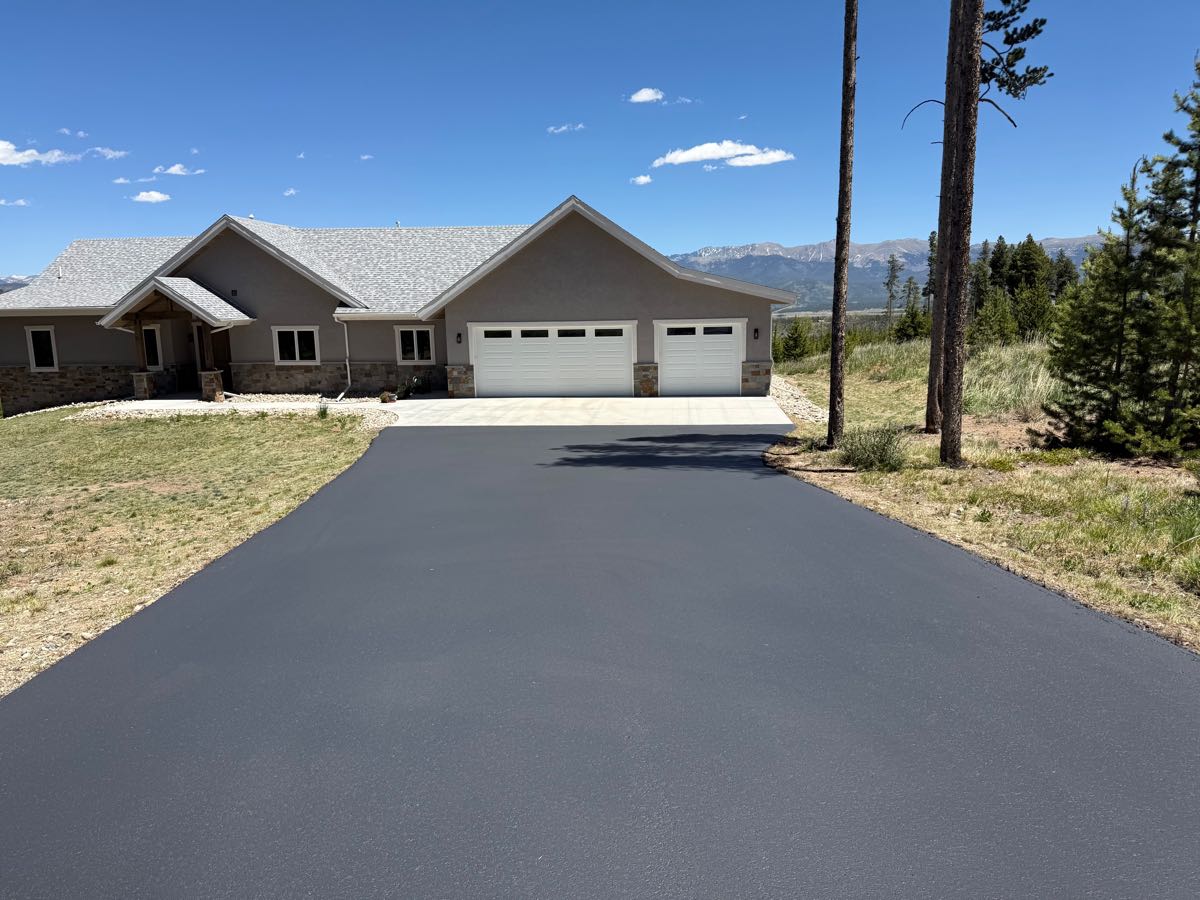 Completed driveway seal coating with Rocky Mountain views — Grand County, CO